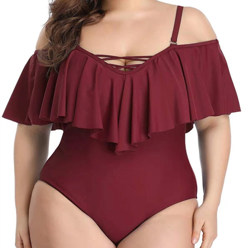 Bikini de talla grande con volantes y diseño cruzado en color liso.